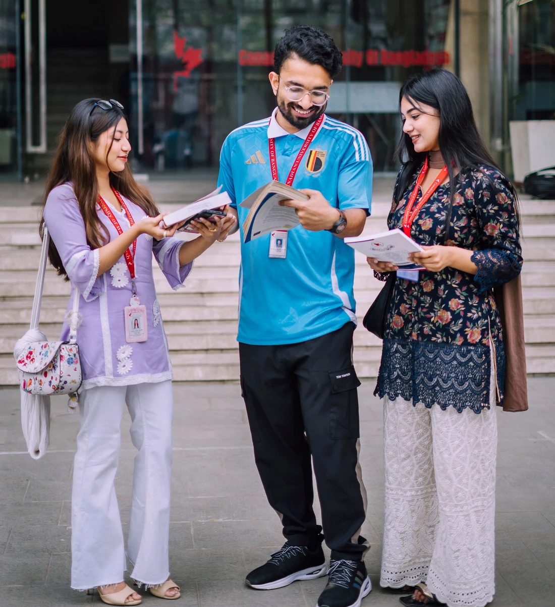 Young students discussing course material outside campus