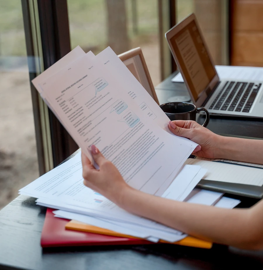 Reviewing paperwork at a desk