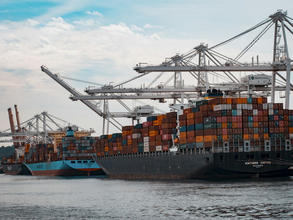 Container port cranes loading a ship
